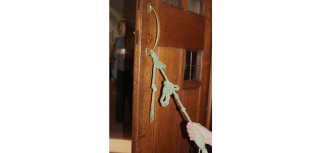 Holding open  the door