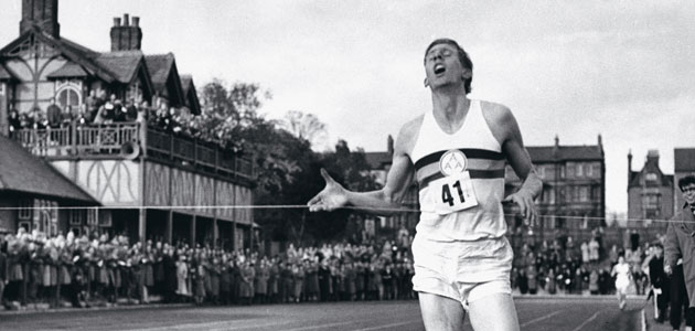 Roger Bannister crosses the line