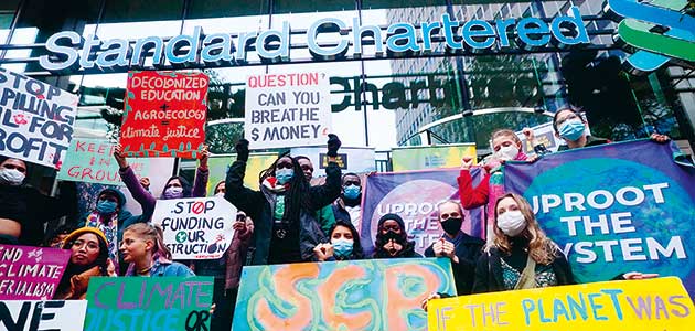 Climate Choir interrupts Standard Chartered AGM